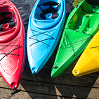 red, blue, green, and yellow canoes